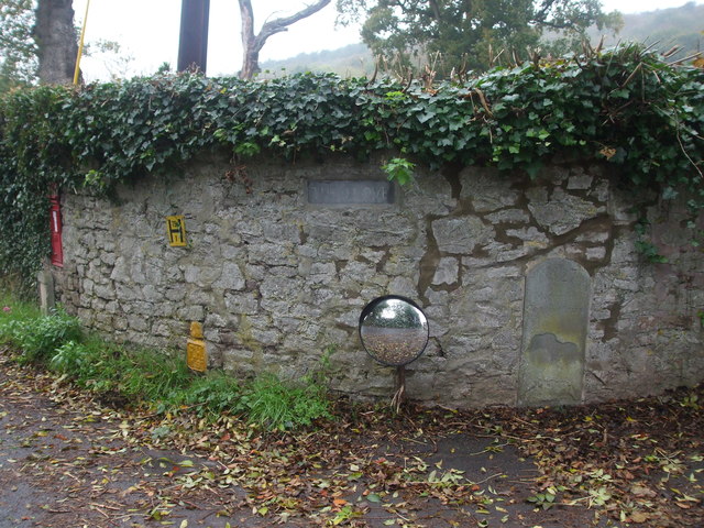 A boundary stone among the utilities