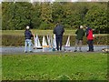 Model enthusiasts with model boats