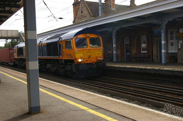 Container train passing Stowmarket station at speed