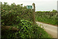 Footpath sign to Newhouse Farm