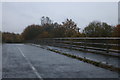 SP3608 : Tar Road crossing the A40 by David Howard