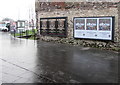 Two triple adverts facing Market Square bus station, Newport