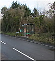 Bus shelter and a bench alongside the A4109 Dulais Road, Seven Sisters