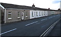 Long row of single-storey houses, Church Road, Seven Sisters