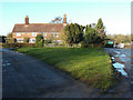 Cottages and grass triangle at Nup End, Codicote