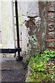 Old benchmark on gatepost at entrance to Old Grove