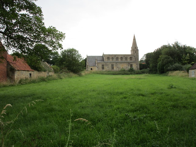 Grass field and St. Bartholomew's church, Welby