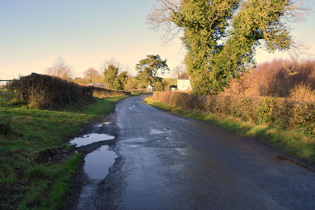 Puddles along Letfern Road © Kenneth Allen cc-by-sa/2.0 :: Geograph Ireland