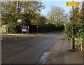 Yellow direction sign for Newland Orchard, Whitminster