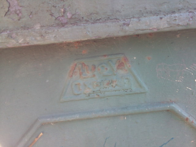 Worn Lucy Oxford logo on electrical cabinet on Penrhos Road, Bangor