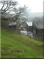 Farm buildings in the rain at Wigney