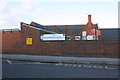 Boundary wall (incorporating an outbuilding) of Brampton Primary School