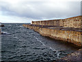 NJ1470 : Hopeman harbour wall by John Lucas