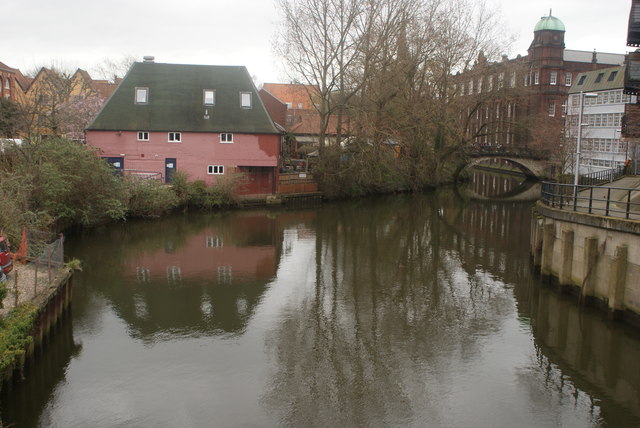 View of the rear of the Norwich Playhouse reflected in the River Wensum from Duke Street