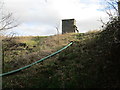 Pump house by a reservoir