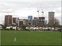 TQ2081 : Eastfields Road and tower blocks from playing field by David Hawgood