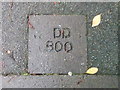 DD marks in pavement on South Road, Caernarfon