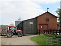 SJ4033 : Tractor in the farmyard by John H Darch