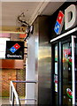 ST2995 : Red and blue dominoes depicted on Domino's name signs in Cwmbran by Jaggery