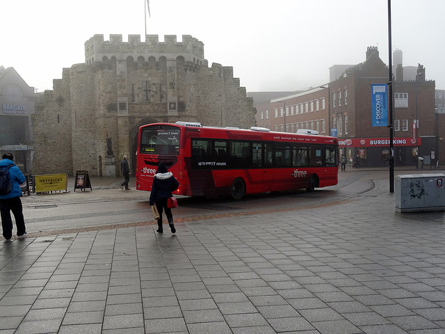 A 'Three' bus rounds Southampton Bargate