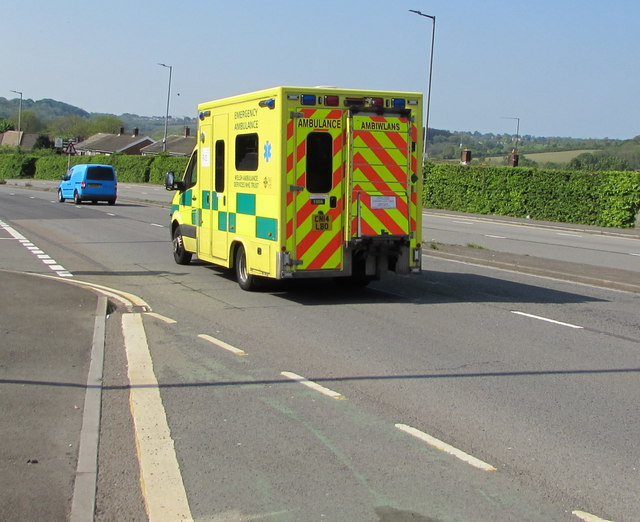Yellow ambulance descending Malpas Road, Newport