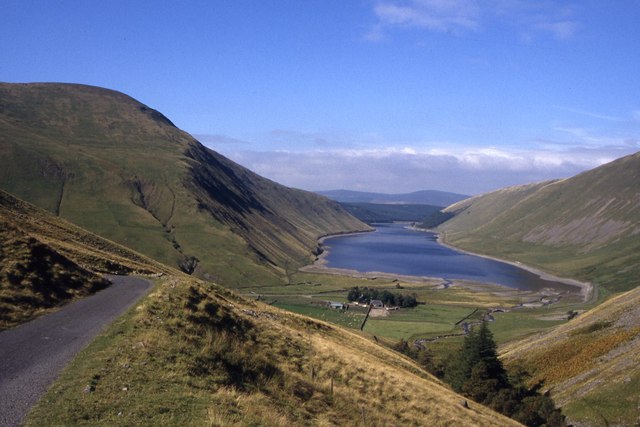 Road leading down to Talla Linnfoots with Talla Reservoir beyond