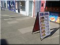 Sign for fish and chip shop on Church Lane, Kingsbury