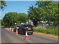 Cars queuing for a household waste recycling centre