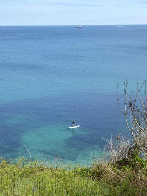 A lone paddleboarder off Bream Cove
