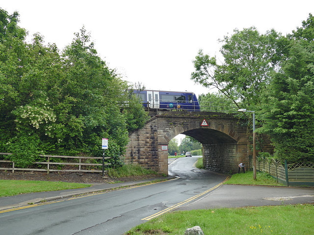 Train crossing the railway bridge by Weeton station
