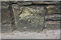 Benchmark on stone in wall on east side of Valley Road