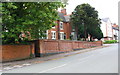 Kettlebrook Road (#184 behind the wall) approaching West Street junction