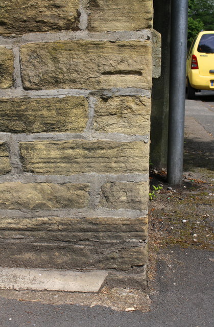 Benchmark on Manningham Lane wall at Spring Bank Place junction