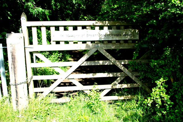 Memorial gate into Waresley Wood