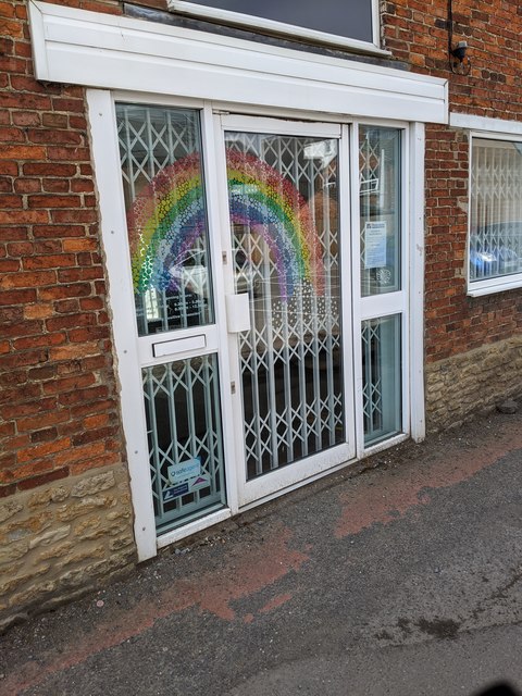 Letting agent door - with pandemic rainbow