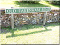 TG1216 : Old Fakenham Road sign by Geographer