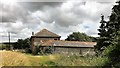 House and outbuilding at Peppering High Barn