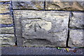 Benchmark on wall on NW side of Great Horton Road