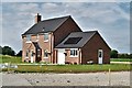 Southolt: New house on a 90 degree bend in the road