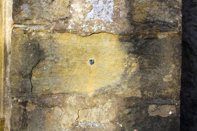 Benchmark on tower buttress of St James's Church