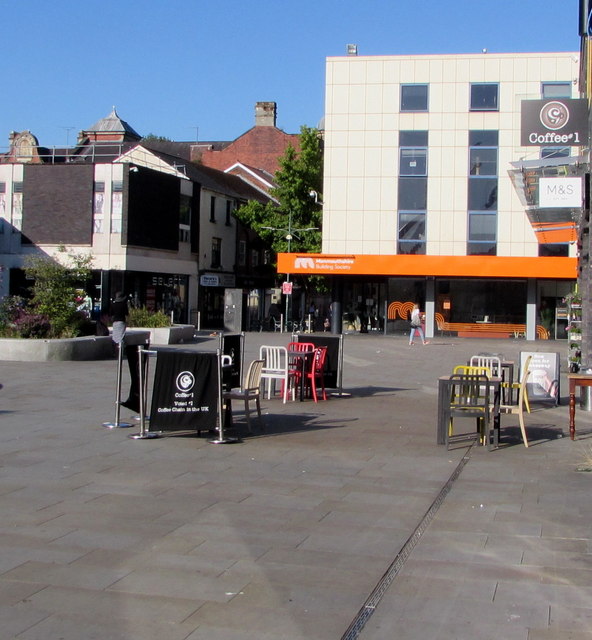 Tables and chairs in John Frost Square, Newport