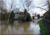 SK6917 : Flooded Mill Lane eastwards by Andrew Tatlow