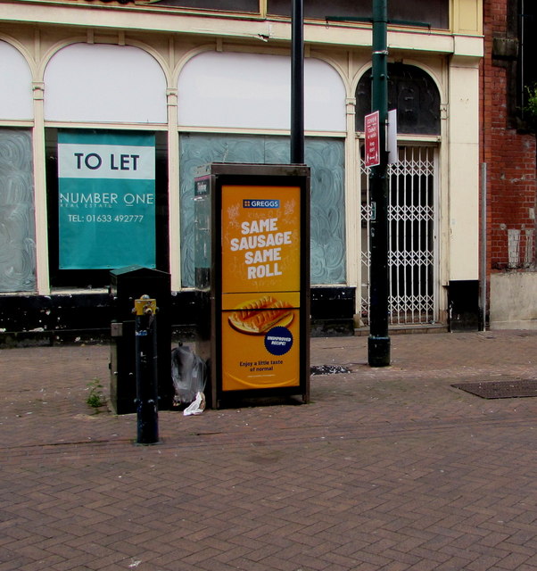Greggs sausage roll advert on a Cambrian Road phonebox, Newport