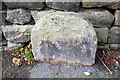 Old stone on NW side of Keighley Road (B6143)