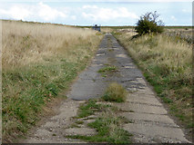 TM0305 : Road out to former Marconi radar station by Robin Webster