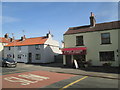 TA0252 : Butchers  shop  and  houses  on  Main  Street by Martin Dawes