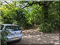 Car parked where a footpath leaves the lane