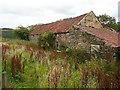 Footpath passing a farm building, Leas Head Farm