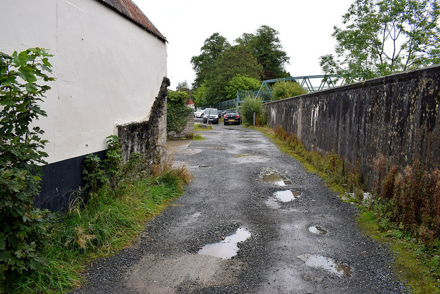 Rough laneway with potholes, Omagh