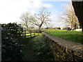 Ha-ha forming the boundary of the churchyard, Thorpe Mandeville